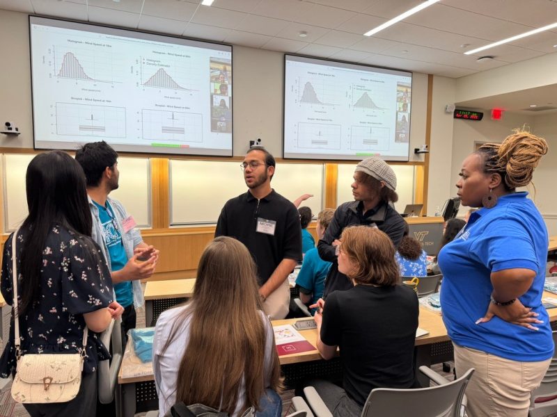 Photo of MORE workshop participants discussing a math problem