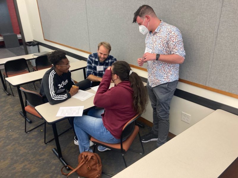 Picture of students working with Dr, Michael Robert.